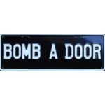 Novelty Number Plate - Bomb A Door White On Black