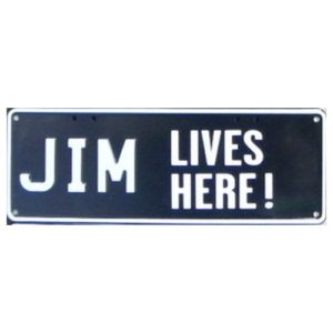Novelty Number Plate - Jim Lives Here Left Justified - White On Black 1 Stickerplate
